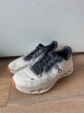 On Running women Beige and Black Sneakers with Orange Details